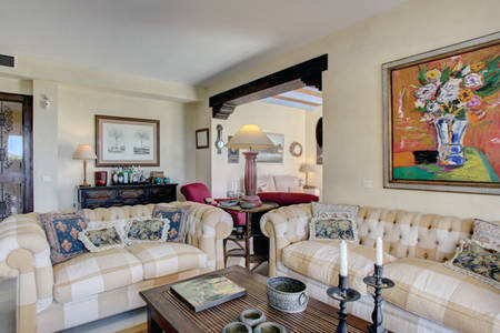 Image show a view of the livig room with large coffee table and sofas