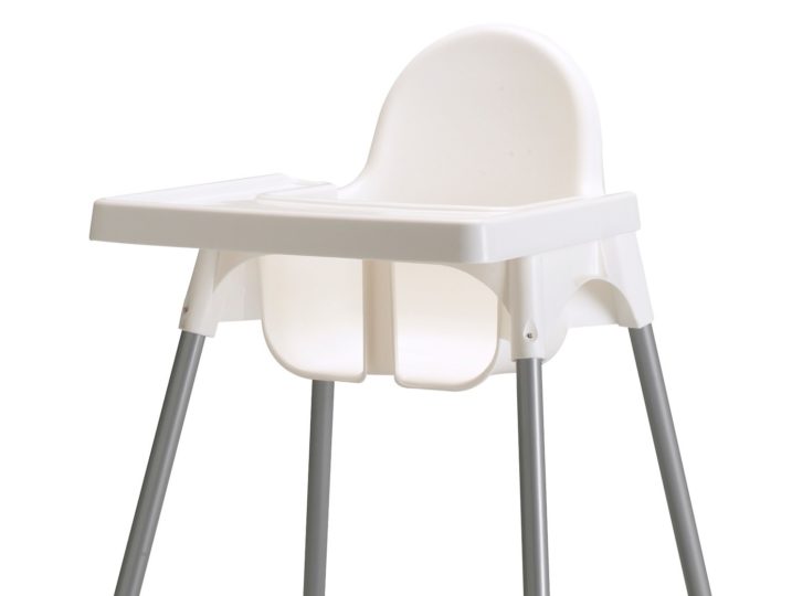 Image shows a white plastic high chair with stainless legs tipped with white plastic caps