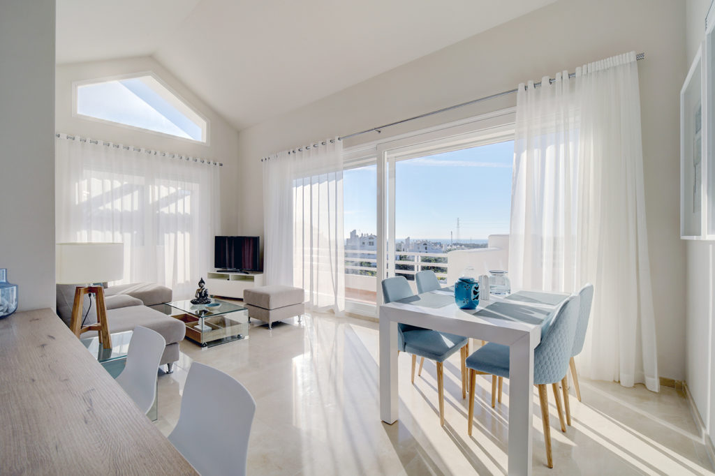 Image shows living rooms with views and large windows to walk on to the terrace