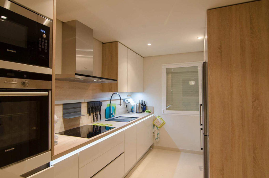 Image shows kitchen and oven hob microwave
