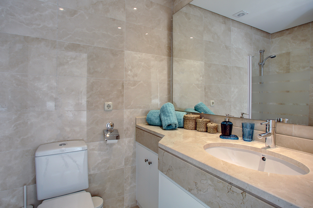 Image shows beautiful bathroom with fitted cabinets