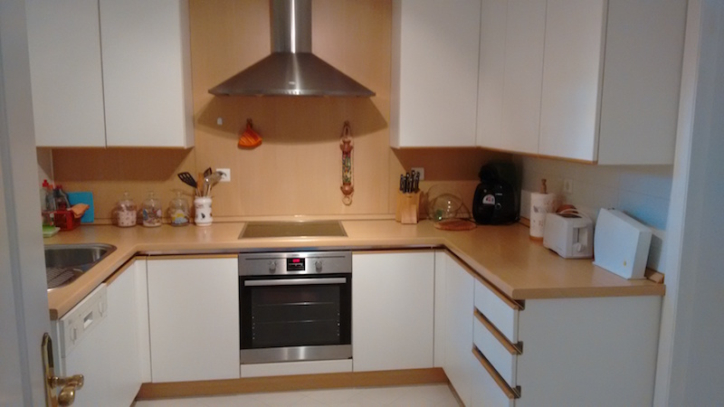 The image shows a large kitchen and hob and oven