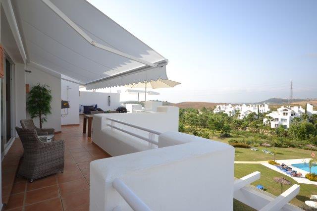 Image shows large terraces and furnished terrace with barbeque