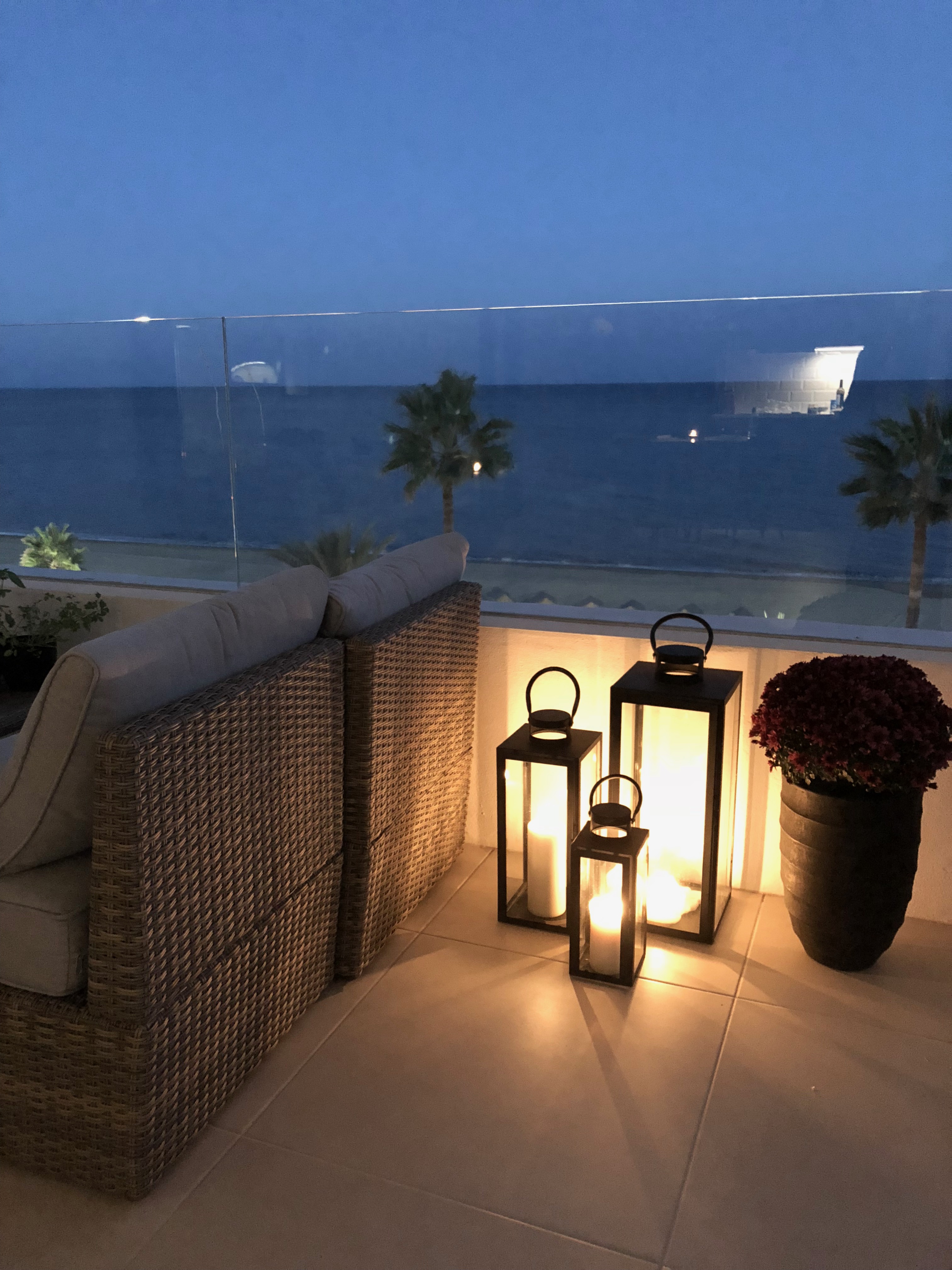 Luxury Penthouse Apartment in Estepona Casa de Gran Vista. Image shows sunset with outside terrace furniture